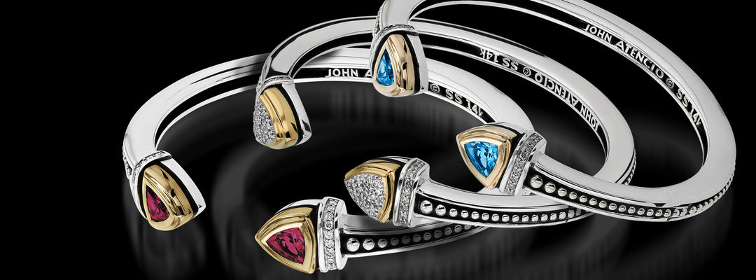 Arrive in style with this trillion and diamond sterling silver and 14 karat gold collection. 