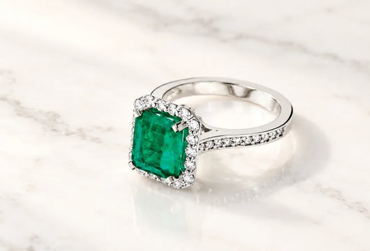 Step Cuts Meet Brilliant Radiance in the Emerald Halo Diamond Ring